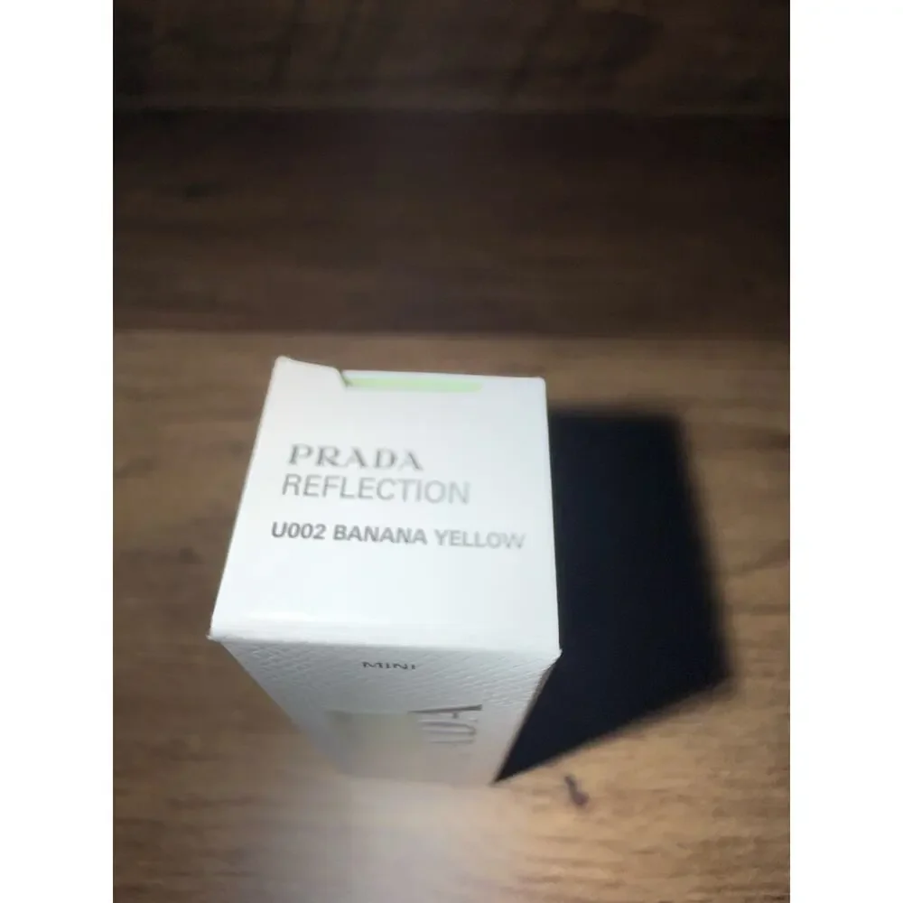 Prada Reflection Glossy Lip Balm in shade U002 Banana Yellow